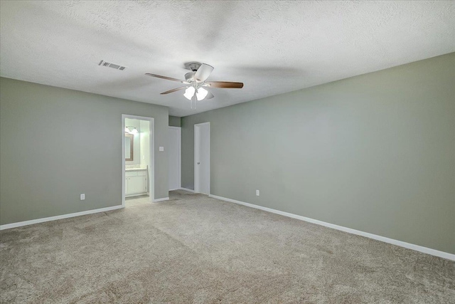 5960 Meadow Way, Beaumont, TX 77707 - empty room with a ceiling fan, light colored carpet, baseboards, and a textured ceiling
