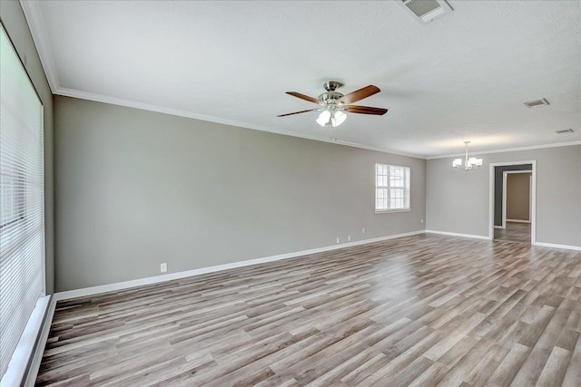 5960 Meadow Way, Beaumont, TX 77707 - spare room featuring a chandelier, light wood finished floors, ceiling fan, baseboards, and crown molding