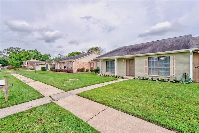 5960 Meadow Way, Beaumont, TX 77707 - single story home featuring a front lawn and brick siding