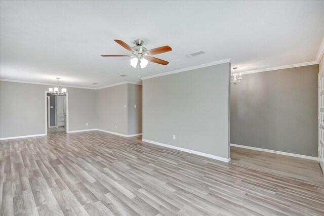 5960 Meadow Way, Beaumont, TX 77707 - unfurnished living room with a chandelier, a ceiling fan, baseboards, light wood finished floors, and crown molding
