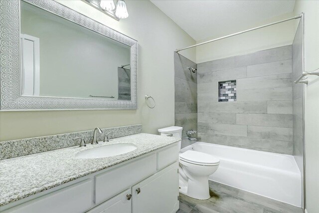 5960 Meadow Way, Beaumont, TX 77707 - bathroom with toilet, vanity, bathing tub / shower combination, and wood finished floors