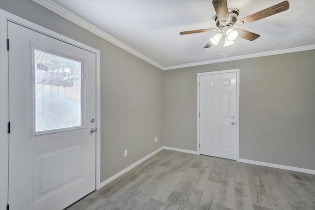 5960 Meadow Way, Beaumont, TX 77707 - foyer entrance featuring a ceiling fan, light wood-type flooring, crown molding, and baseboards