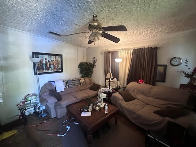 living room featuring ceiling fan and a textured ceiling