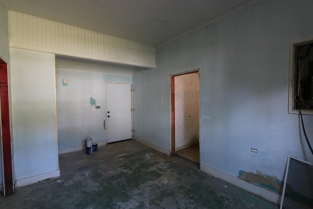 interior space featuring baseboards and concrete floors