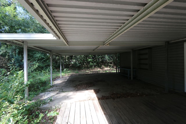wooden deck featuring a carport