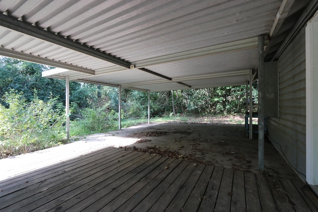 wooden terrace featuring an attached carport