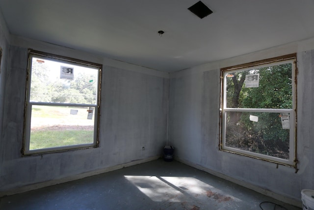 spare room featuring concrete flooring