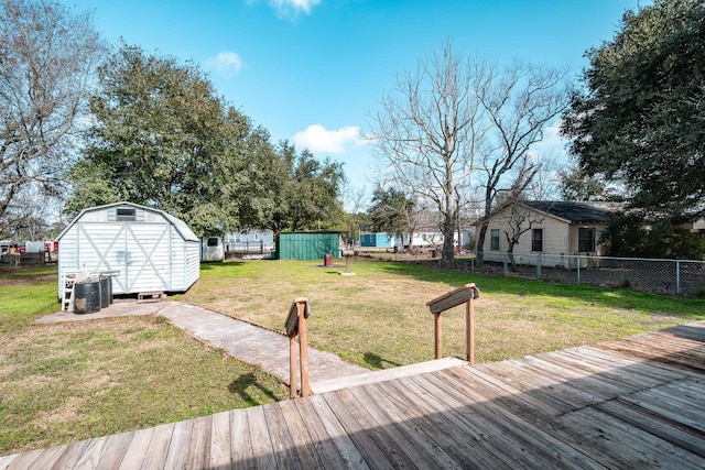 view of yard with a shed and a wooden deck