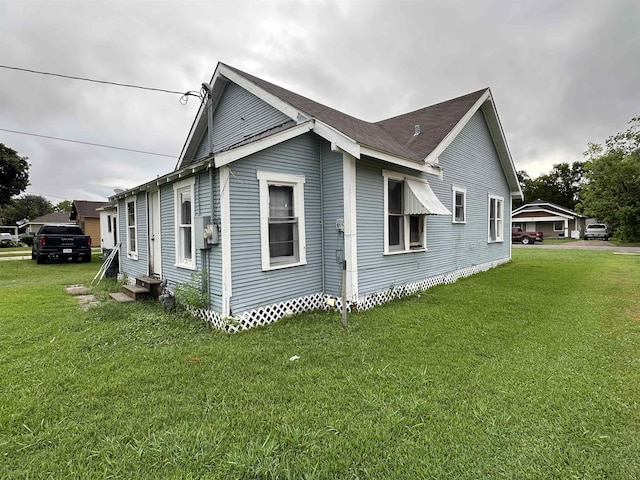 3123 13th St, Port Arthur, TX 77642 - view of side of home featuring a yard and entry steps