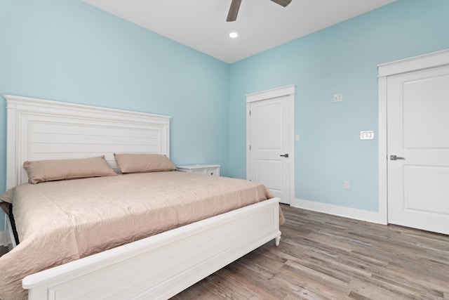 bedroom featuring hardwood / wood-style floors and ceiling fan