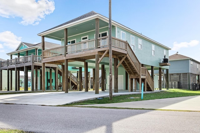 exterior space with a porch and a carport