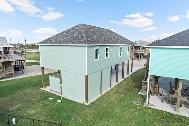 view of home's exterior with a yard and a patio