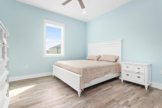 bedroom with ceiling fan and light wood-type flooring