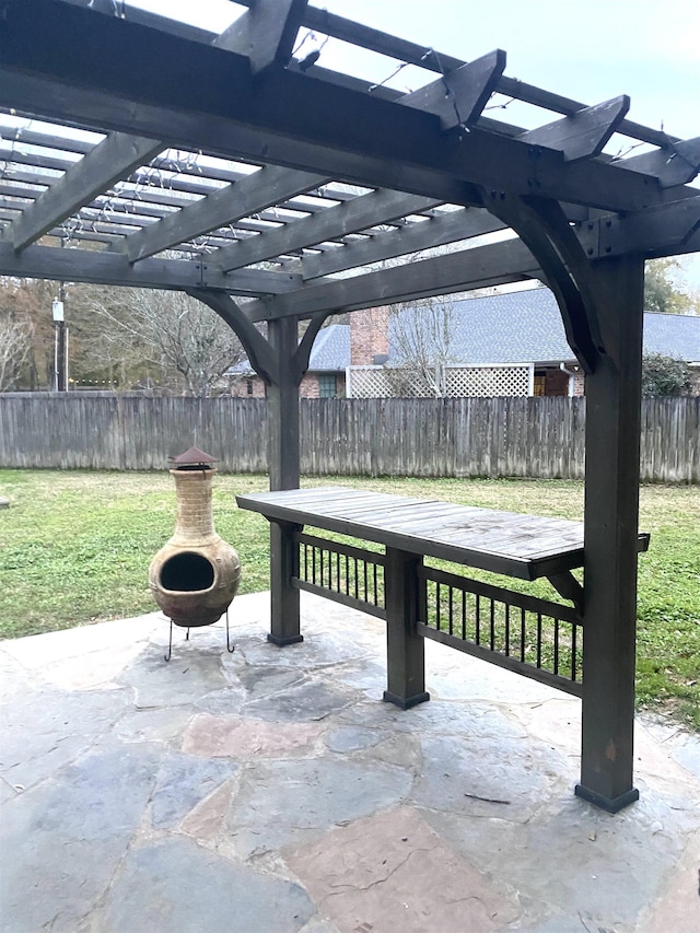 view of patio / terrace featuring a pergola and a fire pit