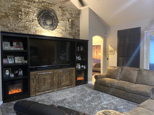 living room with carpet floors and vaulted ceiling