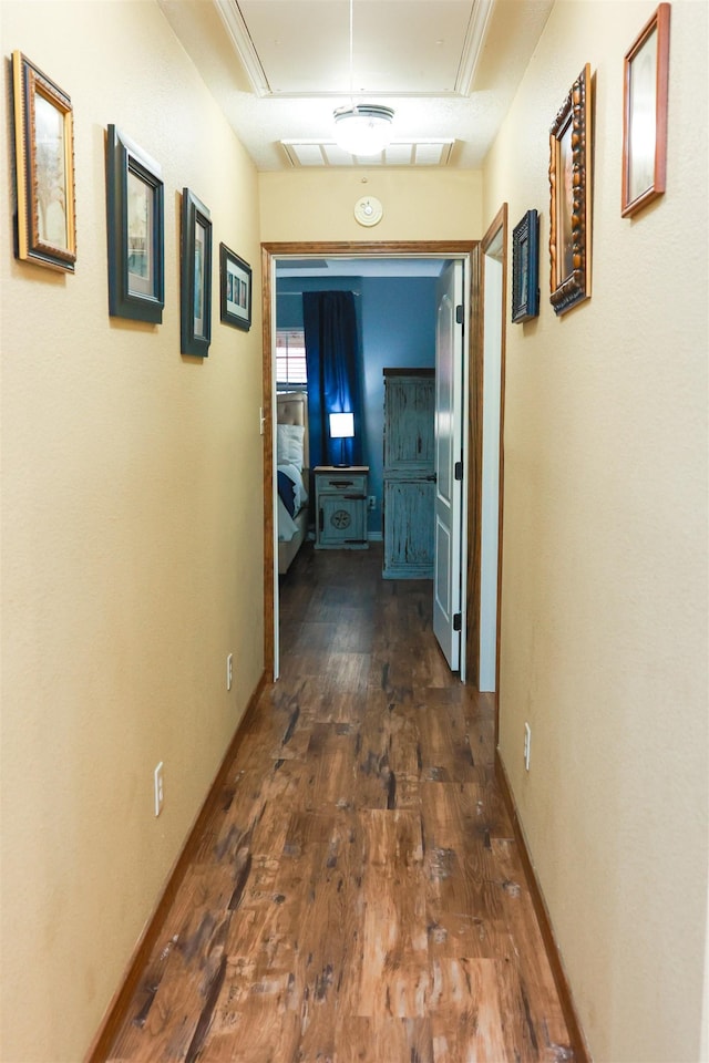 9861 Fm 1442, Orange, TX 77630 - hall with attic access, dark wood-style flooring, and baseboards
