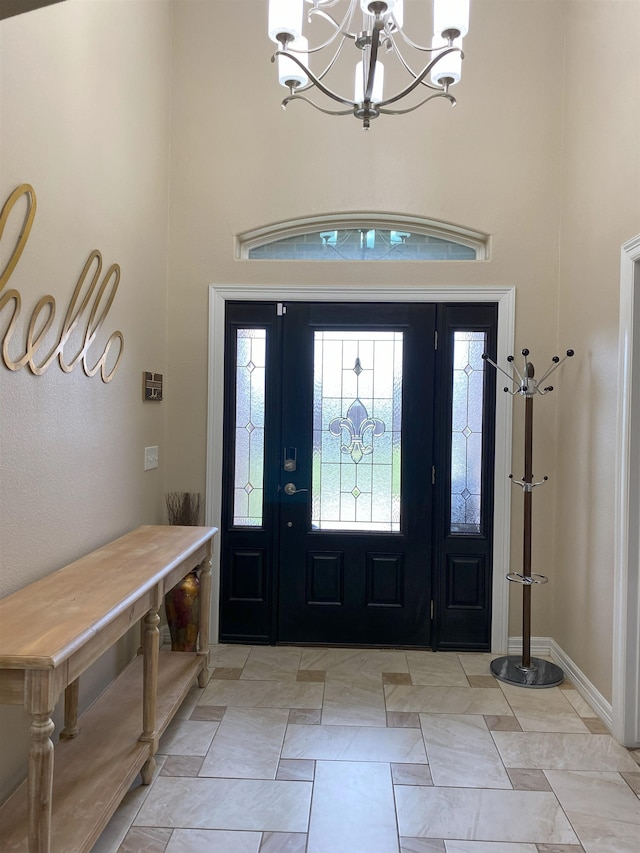 entrance foyer with a high ceiling and an inviting chandelier