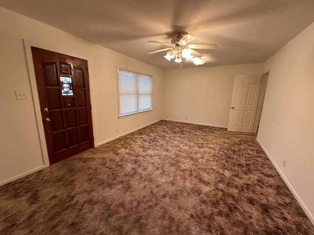 foyer entrance featuring carpet flooring and ceiling fan