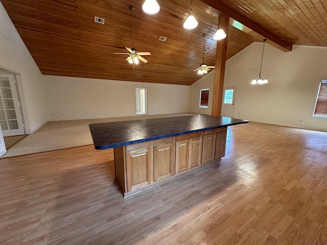 kitchen with a center island, wooden ceiling, ceiling fan with notable chandelier, light hardwood / wood-style flooring, and vaulted ceiling with beams