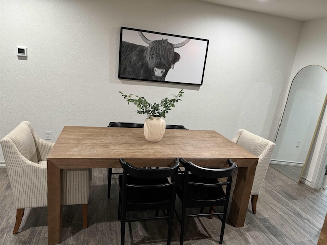 dining area with wood-type flooring