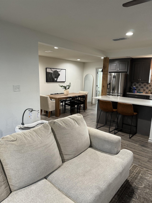 living room featuring dark wood-type flooring