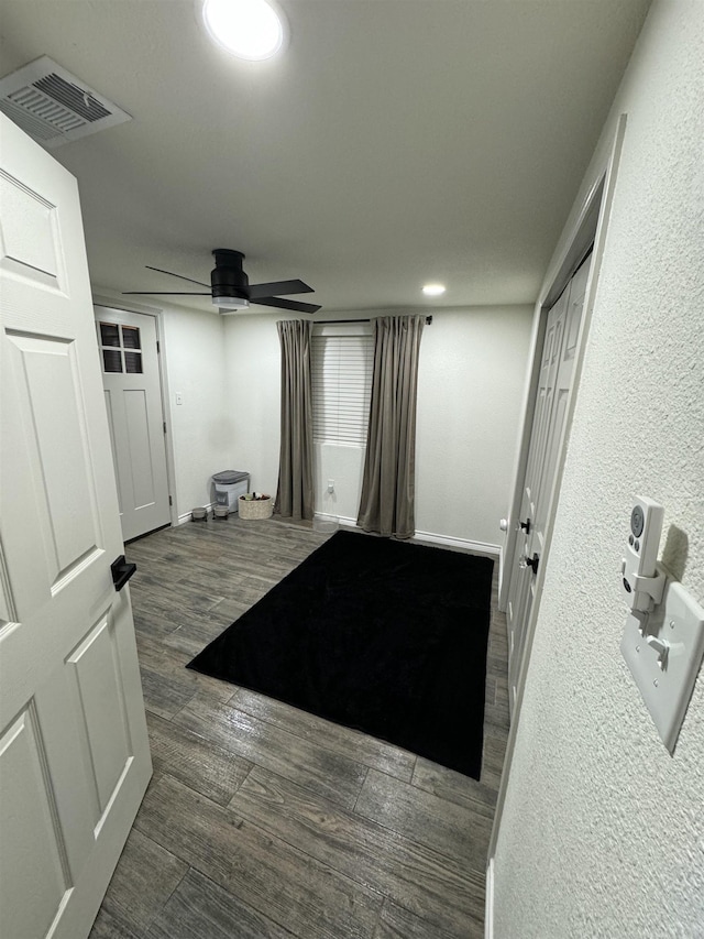 hallway with dark hardwood / wood-style floors