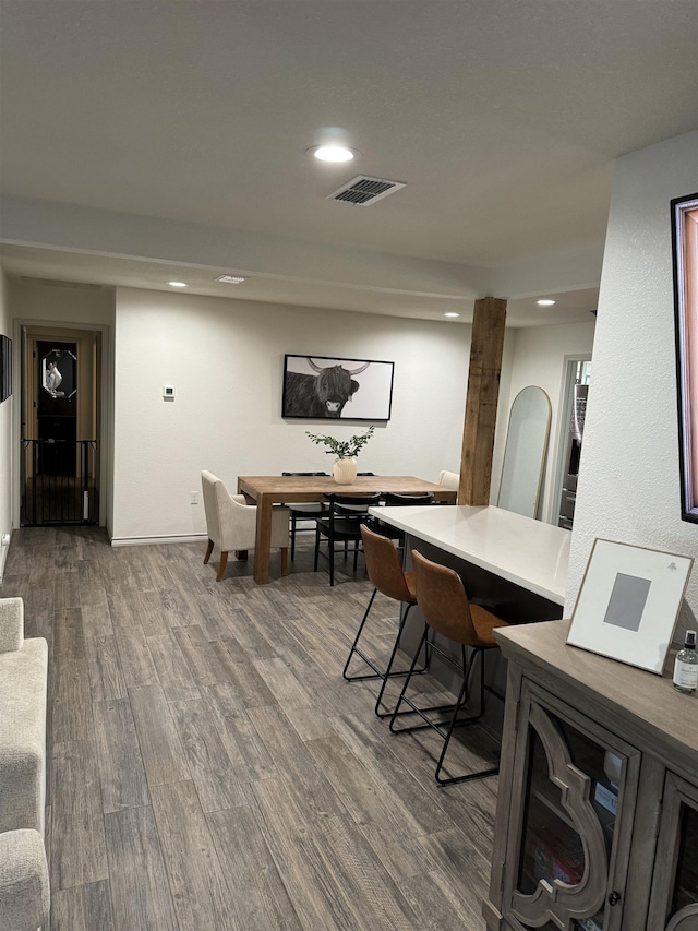 dining space featuring wood-type flooring