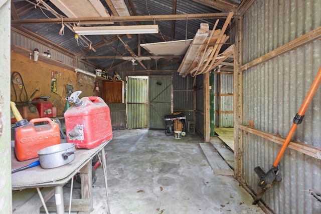 2836 Old Spurger Rd, Silsbee, TX 77656 - miscellaneous room featuring concrete floors and vaulted ceiling