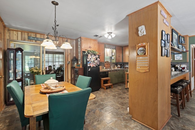 2836 Old Spurger Rd, Silsbee, TX 77656 - dining room featuring stone finish floors and wooden walls