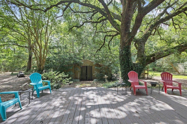 2836 Old Spurger Rd, Silsbee, TX 77656 - deck with an outdoor fire pit and a storage shed