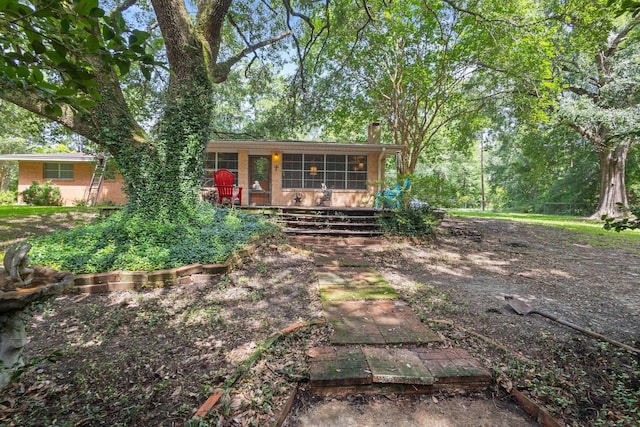 2836 Old Spurger Rd, Silsbee, TX 77656 - view of front facade with a sunroom and a chimney