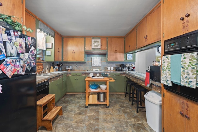 2836 Old Spurger Rd, Silsbee, TX 77656 - kitchen featuring black appliances, stone finish flooring, tasteful backsplash, and brown cabinetry
