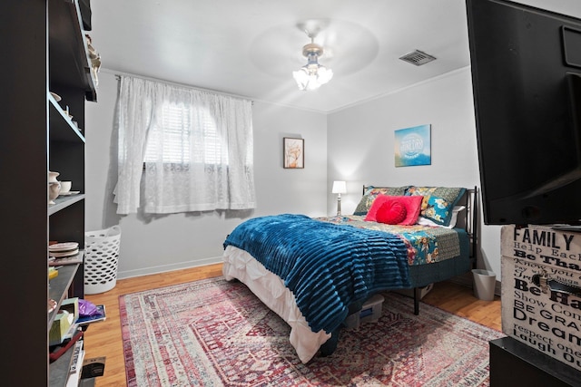 2836 Old Spurger Rd, Silsbee, TX 77656 - bedroom featuring wood finished floors, crown molding, and a ceiling fan