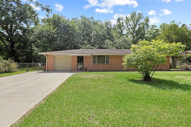 2836 Old Spurger Rd, Silsbee, TX 77656 - view of front of home with an attached garage, concrete driveway, and brick siding