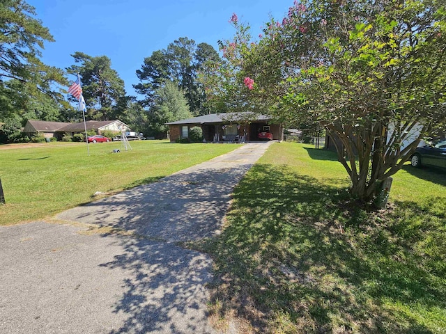 single story home featuring a front yard