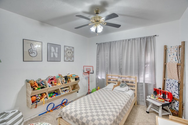 bedroom with carpet flooring and a ceiling fan