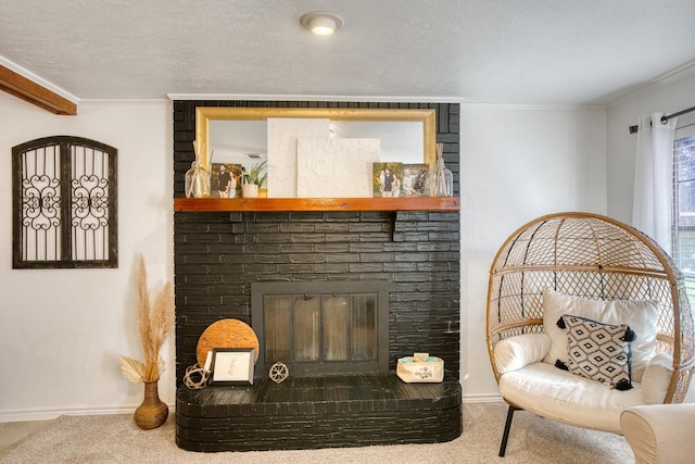 living room with a large fireplace, a textured ceiling, ornamental molding, and carpet flooring