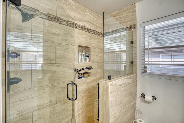 bathroom featuring a stall shower