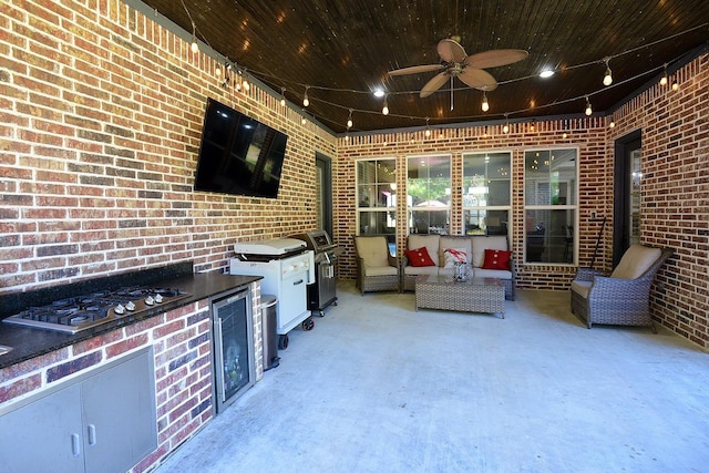 view of patio / terrace with area for grilling, outdoor lounge area, exterior kitchen, and a ceiling fan