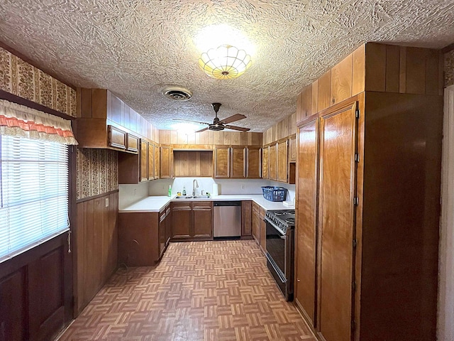 kitchen with brown cabinets, visible vents, electric range, a textured ceiling, and dishwasher