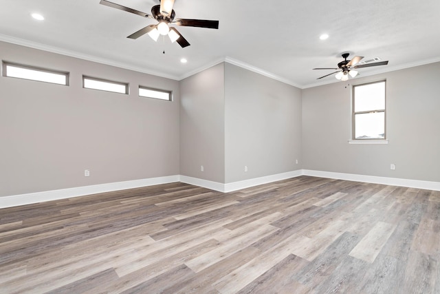 unfurnished room featuring hardwood / wood-style floors, crown molding, and ceiling fan