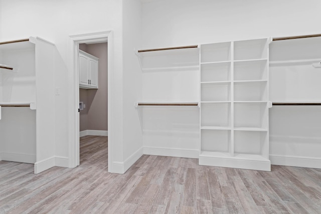 walk in closet featuring light hardwood / wood-style floors