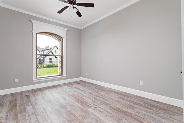 spare room featuring ornamental molding, light hardwood / wood-style floors, and ceiling fan