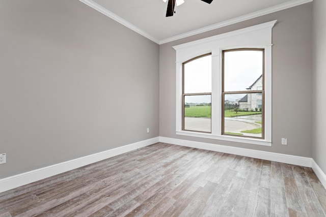 spare room featuring crown molding, ceiling fan, and light hardwood / wood-style floors