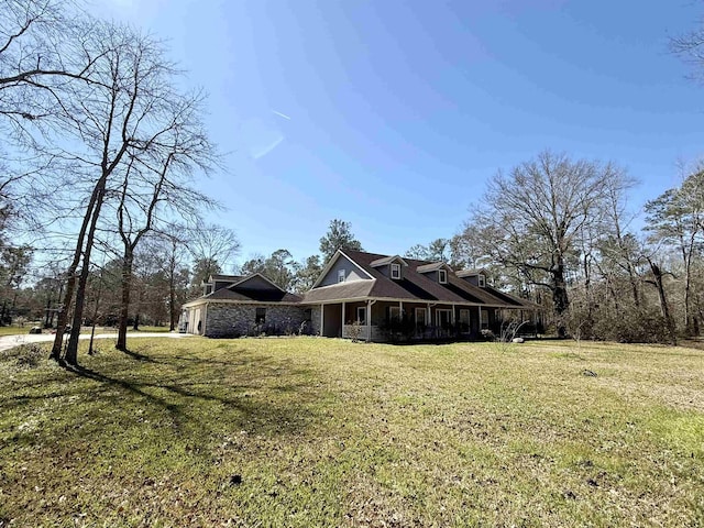 view of side of property with a garage and a yard