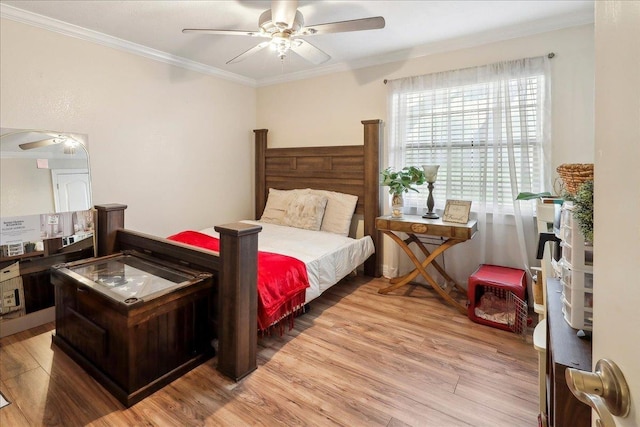 bedroom featuring ceiling fan, light wood finished floors, and crown molding