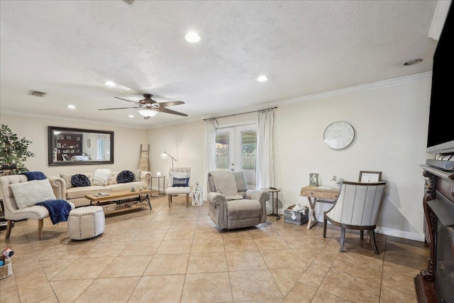 living area with french doors, visible vents, and crown molding