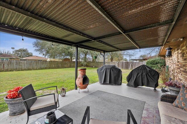 view of patio / terrace featuring a fenced backyard and a grill