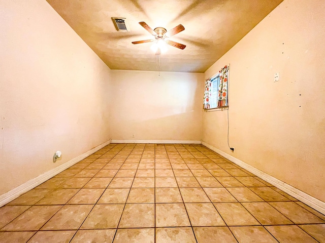 unfurnished room featuring ceiling fan and light tile patterned floors