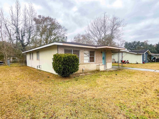 single story home with a carport and a front yard